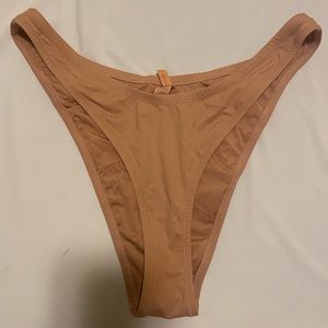 Skims Signature Swim Cheeky Tanga Bottoms in Ochre (XL)